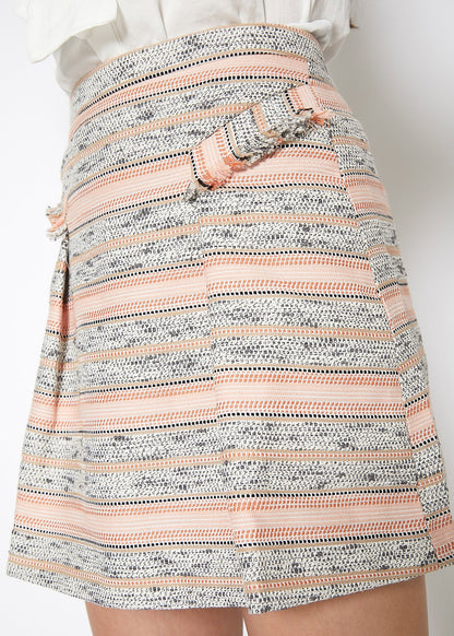 Pink striped tweed mini skirt by Lemon Hera, showing close-up of textured fabric and stylish high waist fit.