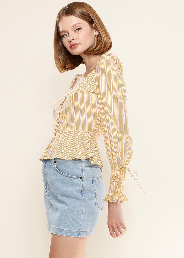Yellow smocked cuff button-front peplum blouse from Lemon Hera, stylish tops and blouses with a feminine design.