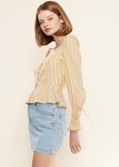 Yellow smocked cuff button-front peplum blouse from Lemon Hera, stylish tops and blouses with a feminine design.