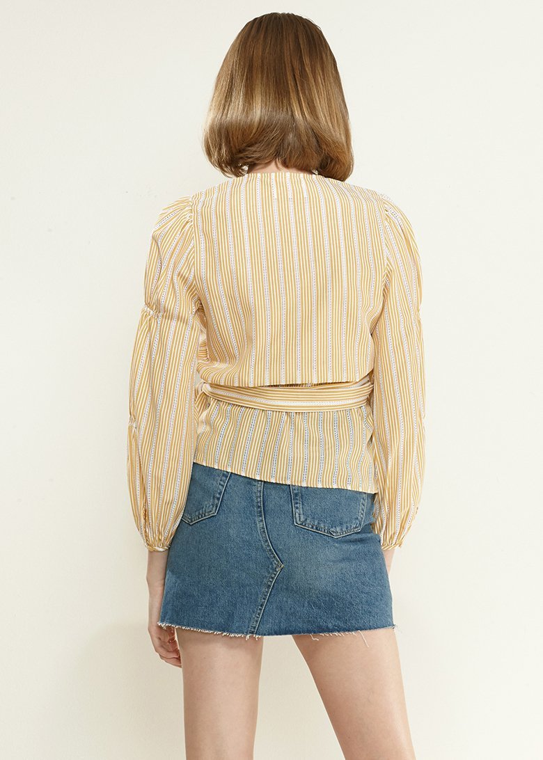 Yellow striped wrap blouse with smocked sleeves from Lemon Hera, featuring a stylish and feminine design.