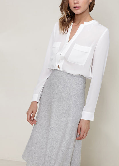 Heather grey high-waisted wool knit midi skirt by Lemon Hera, styled on a model showcasing its fit and texture.