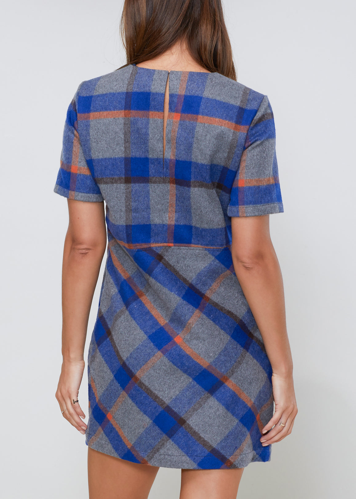 Buffalo plaid wool blend tee dress by Lemon Hera, featuring a casual fit, long sleeves, and classic red, black, and white checkered pattern.