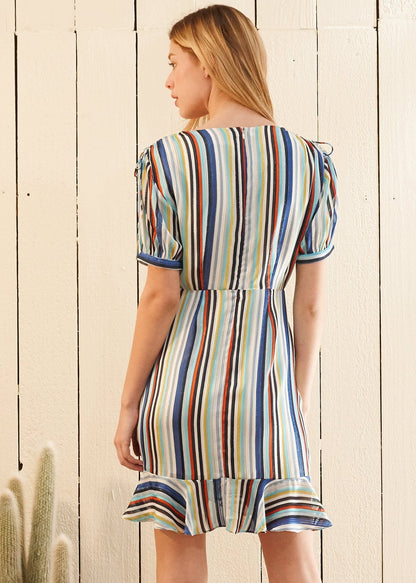 Multi-color ruched beach dress by Lemon Hera, featuring vibrant fabric and a stylish, fitted design for summer wear.