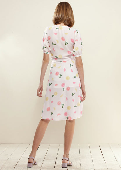 Lemon Hera button front midi skirt in vibrant Fruit Punch color, featuring a flowy design and mid-length silhouette.
