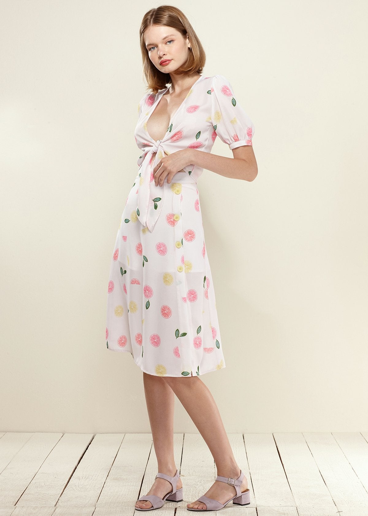 Lemon Hera button front midi skirt in vibrant Fruit Punch color, featuring a stylish midi length and button details.