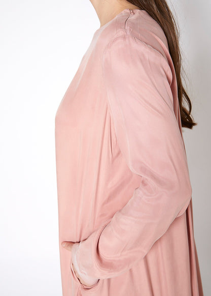 Women’s blush long sleeve crew neck dress by Lemon Hera, showcasing a simple, elegant design with a comfortable fit.