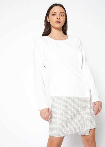 Ivory tweed hem faux wrap dress by Lemon Hera, showcasing the elegant dress with a wrap-style design and textured fabric.