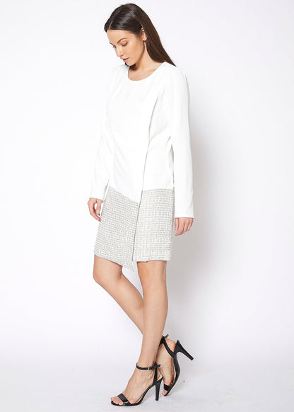 Ivory tweed hem faux wrap dress by Lemon Hera, showing the stylish dress with a wrap design and textured tweed hem.