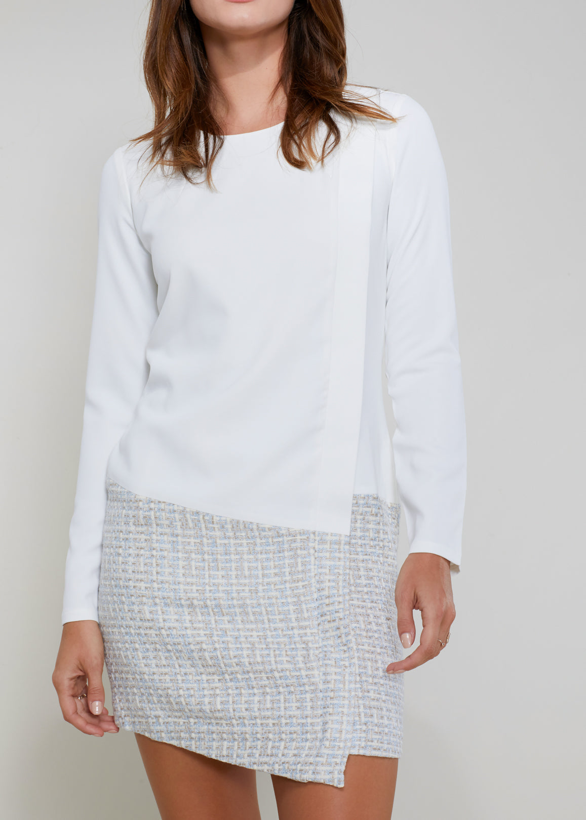 Ivory tweed hem faux wrap dress by Lemon Hera, featuring a stylish wrap silhouette and textured fabric.