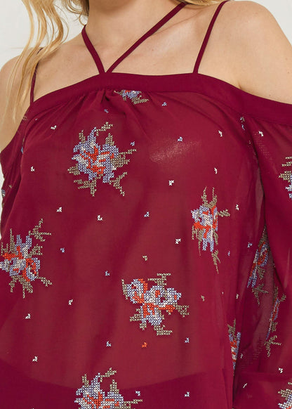Off shoulder embroidery print blouse in burgundy by Lemon Hera, featuring floral embroidery and flowing fabric.