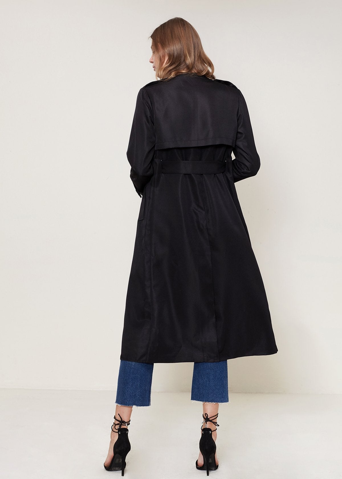 Black Ro &amp; De Tie Waist Maxi Trench Coat by Lemon Hera, shown on a model with long sleeves and a waist tie detail.