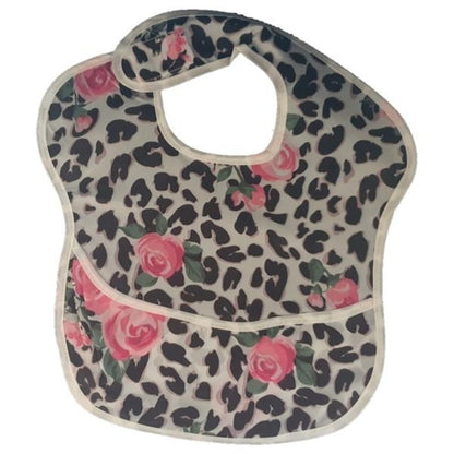 Pink roses waterproof baby bib with crumb catcher, made of denim, by Raspberry Pallas, designed for messy eating and easy cleanup.
