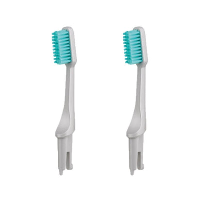 Two Gray Hestia sustainable toothbrush replacement heads with medium Kiesel bristles on white plastic bases.