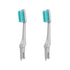 Two Gray Hestia sustainable toothbrush replacement heads with medium Kiesel bristles on white plastic bases.