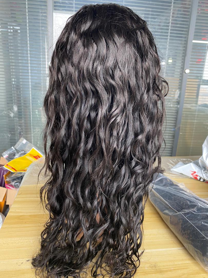 BeuMax Brazilian 13x4 water wave lace front human hair wig by Cerise Alfie, showcasing natural water wave texture and lace front design.