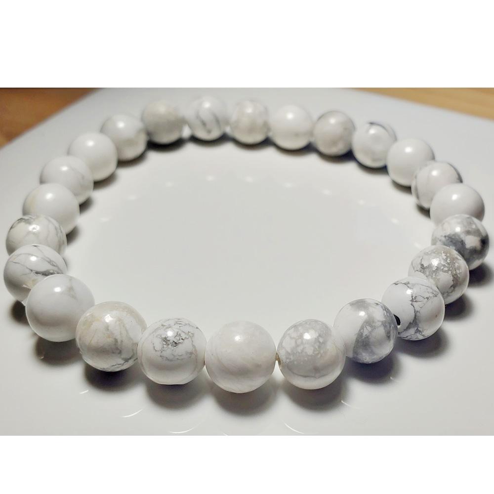 White Howlite beaded elastic stretch bracelet by Silver Hestia, featuring smooth round white stones for stylish jewelry wear.
