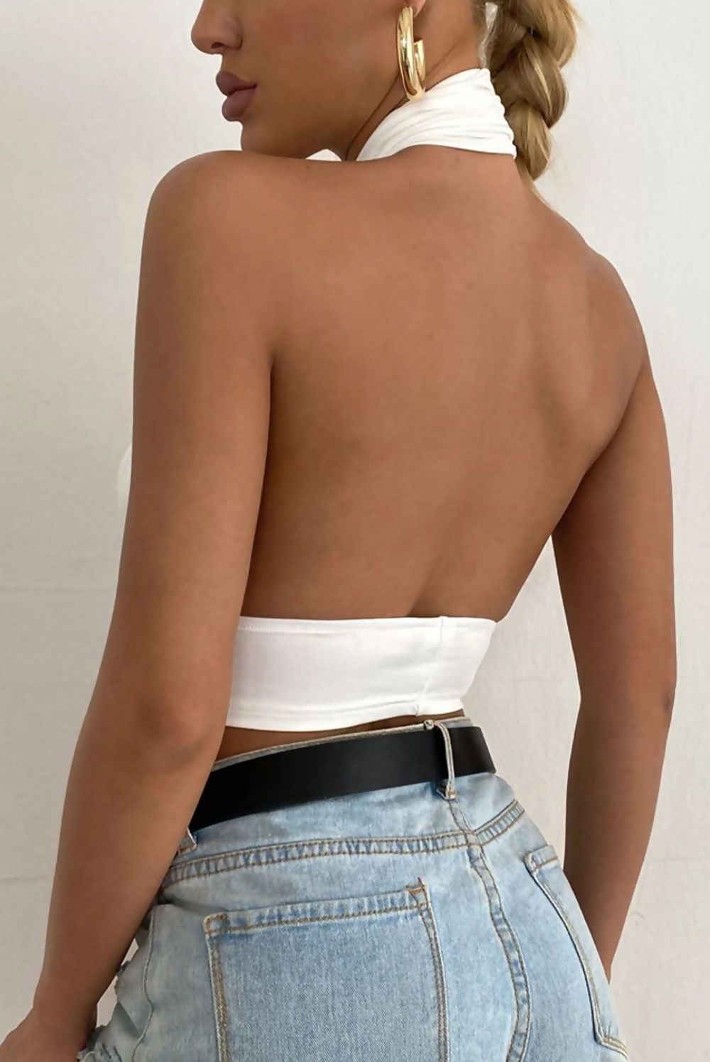 White cross front halter neck underbust top for women by Azure Theseus, featuring a stylish design and fitted silhouette.
