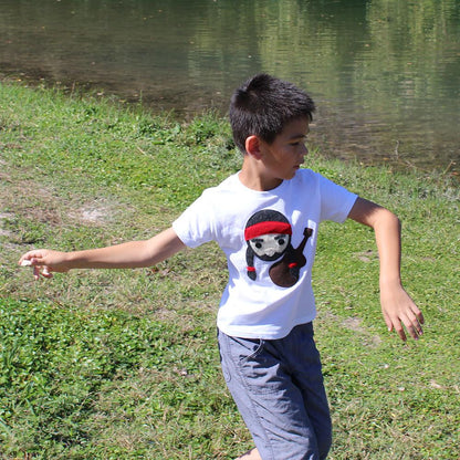 Kids T-shirt by Sky Blue Milo featuring Willie the Music Man design with a rock throw illustration on the front.