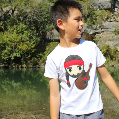 Kids T-shirt featuring Willie the Music Man from Sky Blue Milo, with colorful musical design on a soft fabric background.