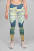 Sky Felix Alpine Scenry leggings featuring a scenic mountain print, shown on a model with a fitted style and vibrant colors.