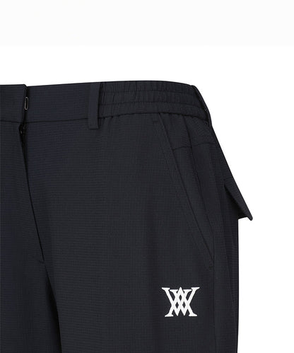 Black women’s deformation mesh jogger long pants by Amethyst Lucy featuring a comfortable, stretchy design and tapered fit.