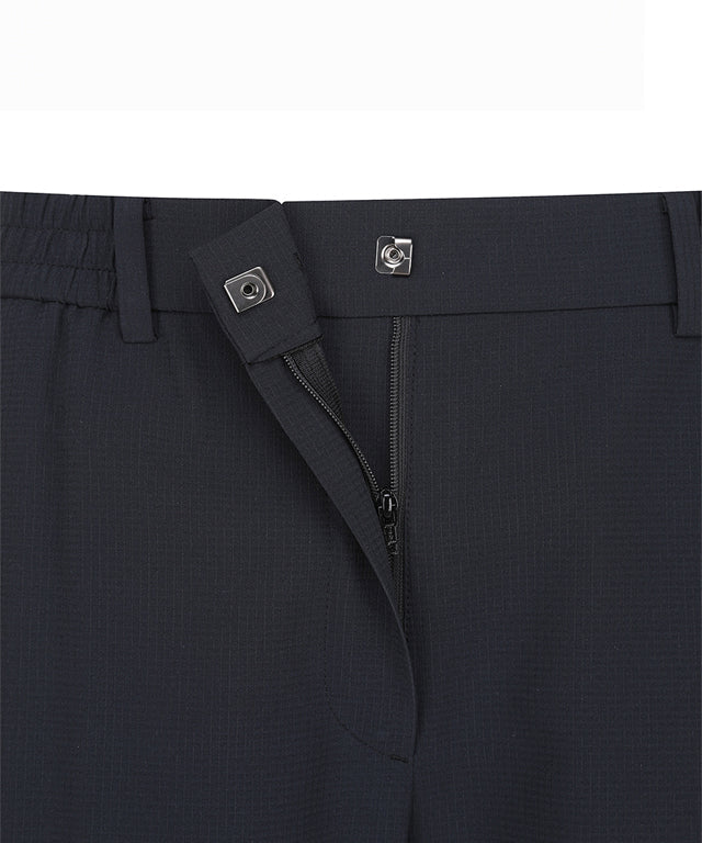 Black women’s deformation mesh jogger long pants by Amethyst Lucy, featuring a stretchy, breathable fabric and relaxed fit.