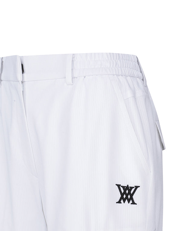 Women’s white deformation mesh jogger long pants by Amethyst Lucy from ANEW Golf, showing the sporty, breathable design and relaxed fit.