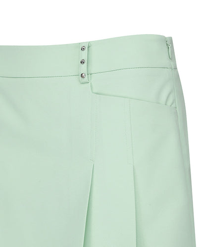 Light green women’s golf skirt with half pleats and under line point design by Amethyst Lucy, showcasing its stylish and comfortable fit.