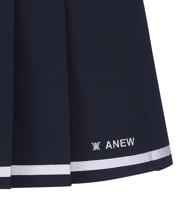 Navy women’s ANEW Golf half-pleats under-line point skirt by Amethyst Lucy, shown in a stylish and comfortable design.