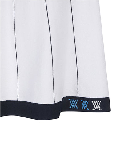White preppy golf skirt for women by Amethyst Lucy, featuring a classic design and tailored fit for sporty style.