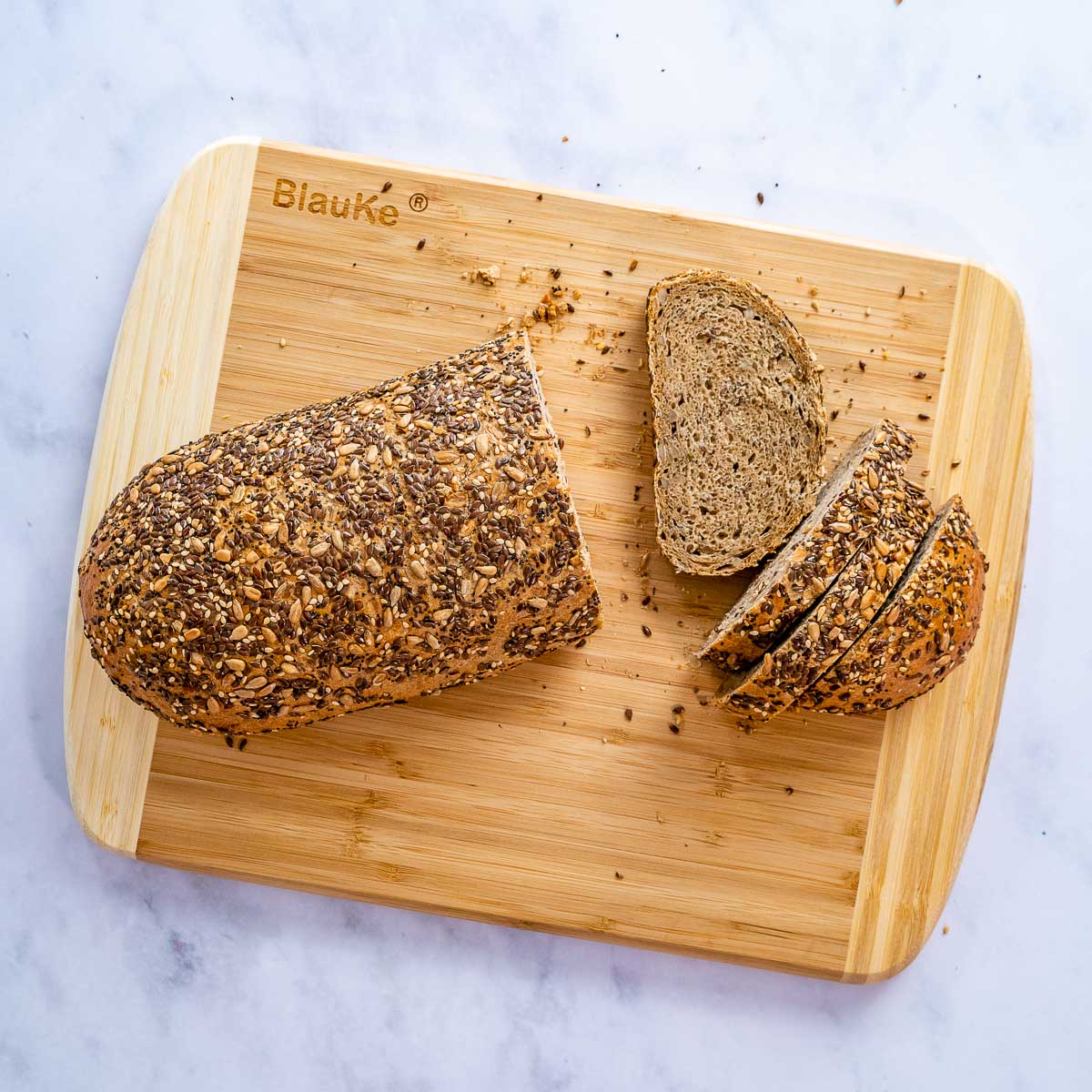 Large bamboo kitchen cutting board by Jade Danae, 14x11 inches, ideal for chopping and food prep with a sturdy wooden surface.
