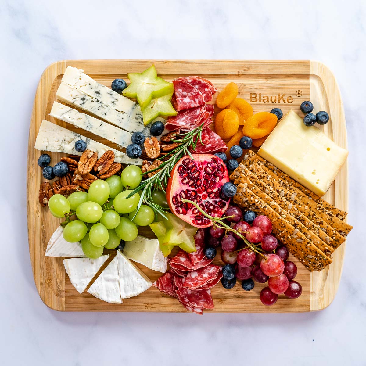 Large bamboo kitchen cutting board by Jade Danae, 14x11 inches, ideal for chopping and food preparation.