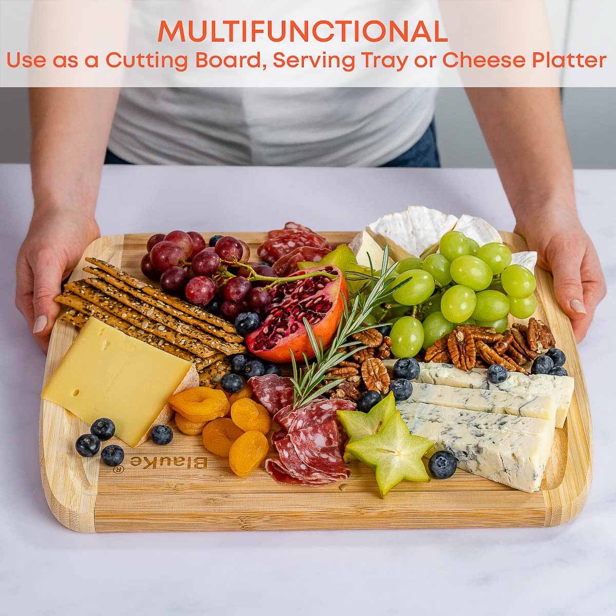 Large bamboo kitchen cutting board by Jade Danae, 14x11 inches, with a smooth wooden surface for chopping and food prep.