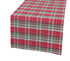 Pink Leto Holiday Tartan Table Runner for home decor, with red and green tartan pattern on a wooden table.