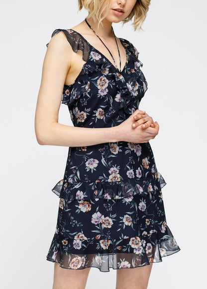 Navy wax flower mini ruffled sleeveless dress by Lemon Hera, featuring a fitted bodice and playful ruffle details.