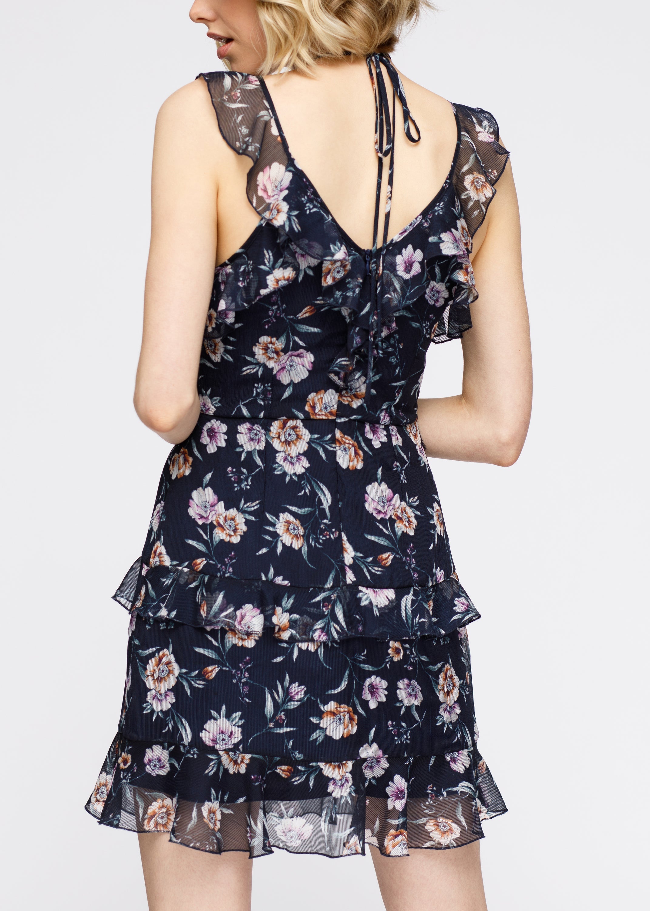 Navy Wax Flower Mini Ruffled Sleeveless Dress by Lemon Hera, showing the dress&