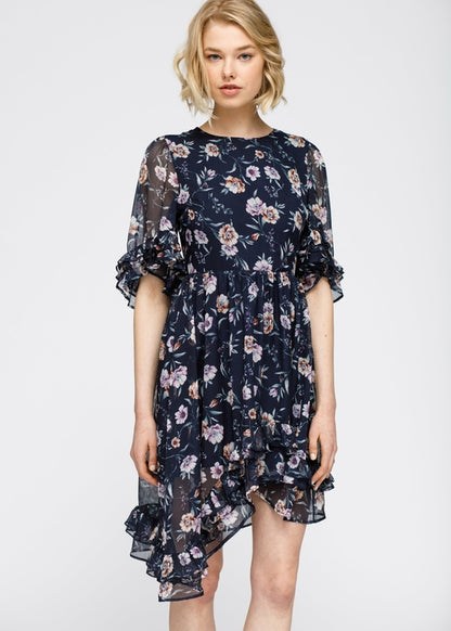 Navy wax flower asymmetrical hi-lo dress by Lemon Hera featuring floral patterns and flowing fabric, stylish and elegant for special occasions.
