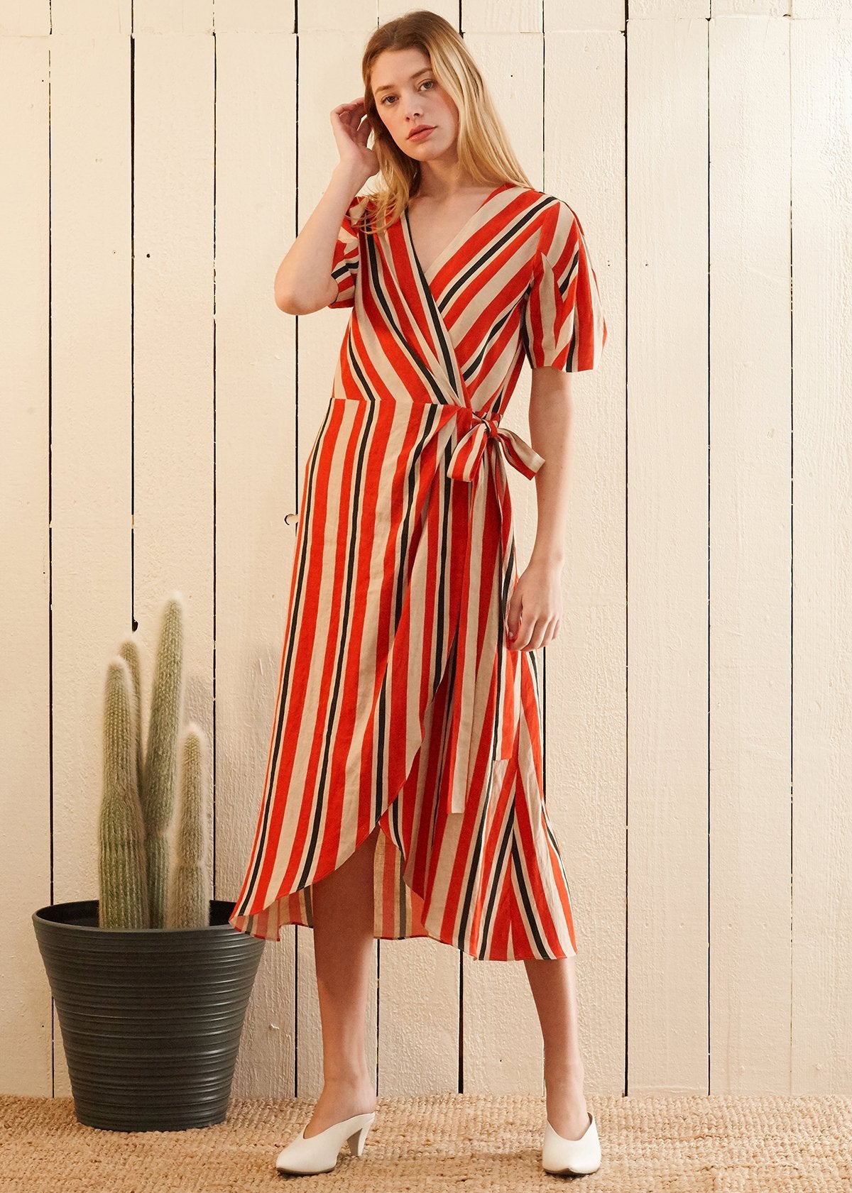 Lemon Hera puff sleeve wrap dress in Poppy Multi with floral pattern, featuring a fitted waist and flowing skirt.