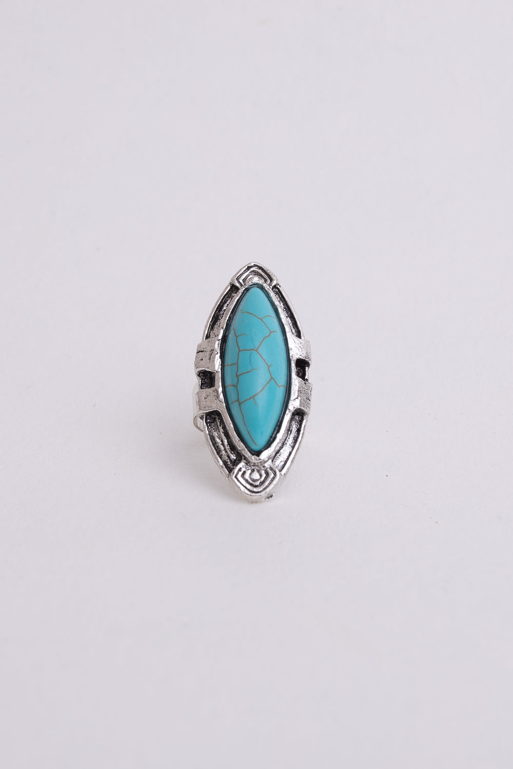 Silver ring with turquoise marquise-cut gemstone, stylish accessories by Periwinkle Aether, showcasing a detailed close-up of the ring.