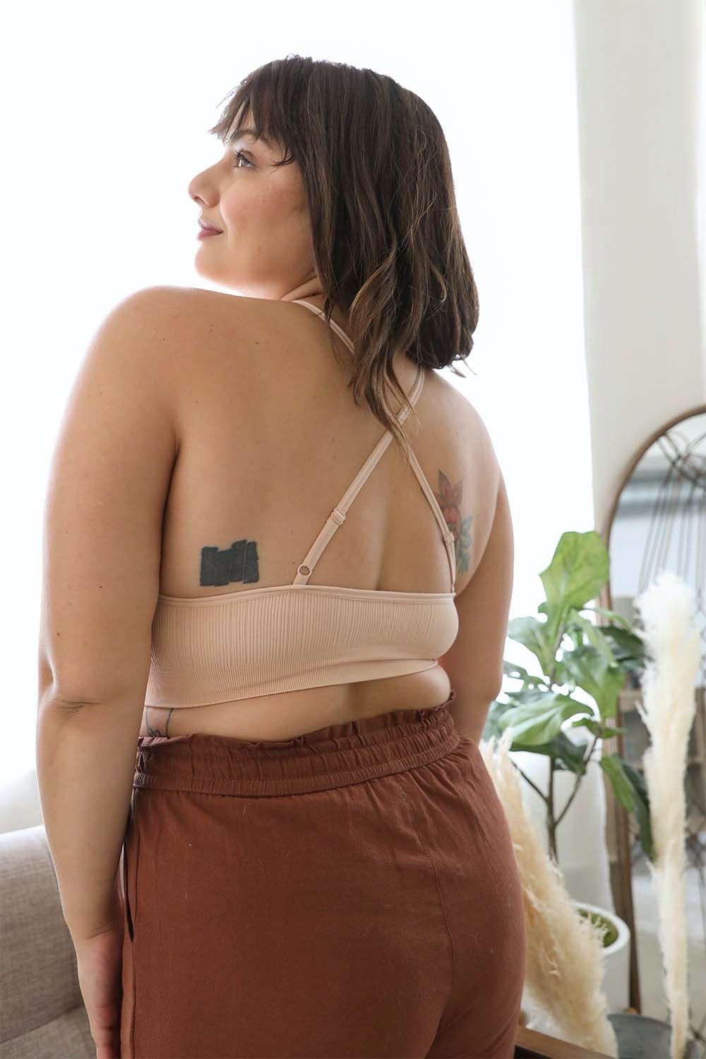 Blush pink crochet lace high neck bralette with halter style and cross-back design, stylish lingerie by Periwinkle Aether.