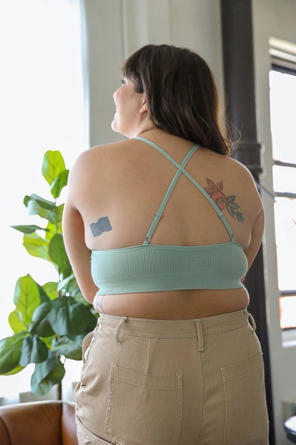 Periwinkle Aether crochet lace high neck bralette with halter style and cross-back design, featuring intricate lace details.