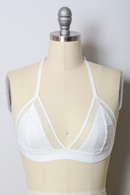 White crochet T-back bralette by Periwinkle Aether, featuring delicate lace details and comfortable lingerie design.