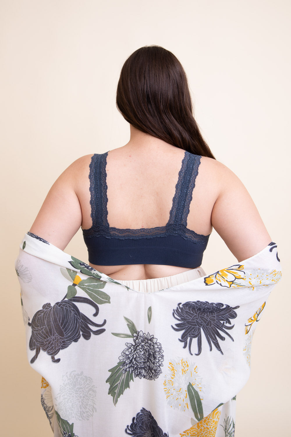 Blue lace trim padded bralette by Periwinkle Aether with adjustable straps, designed as a stylish accessories piece.