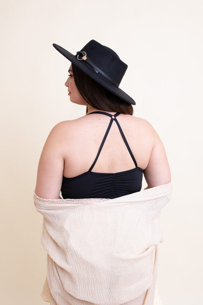 Black ruched bralette tank top by Periwinkle Aether, showcasing a fitted, ruched design with adjustable straps.