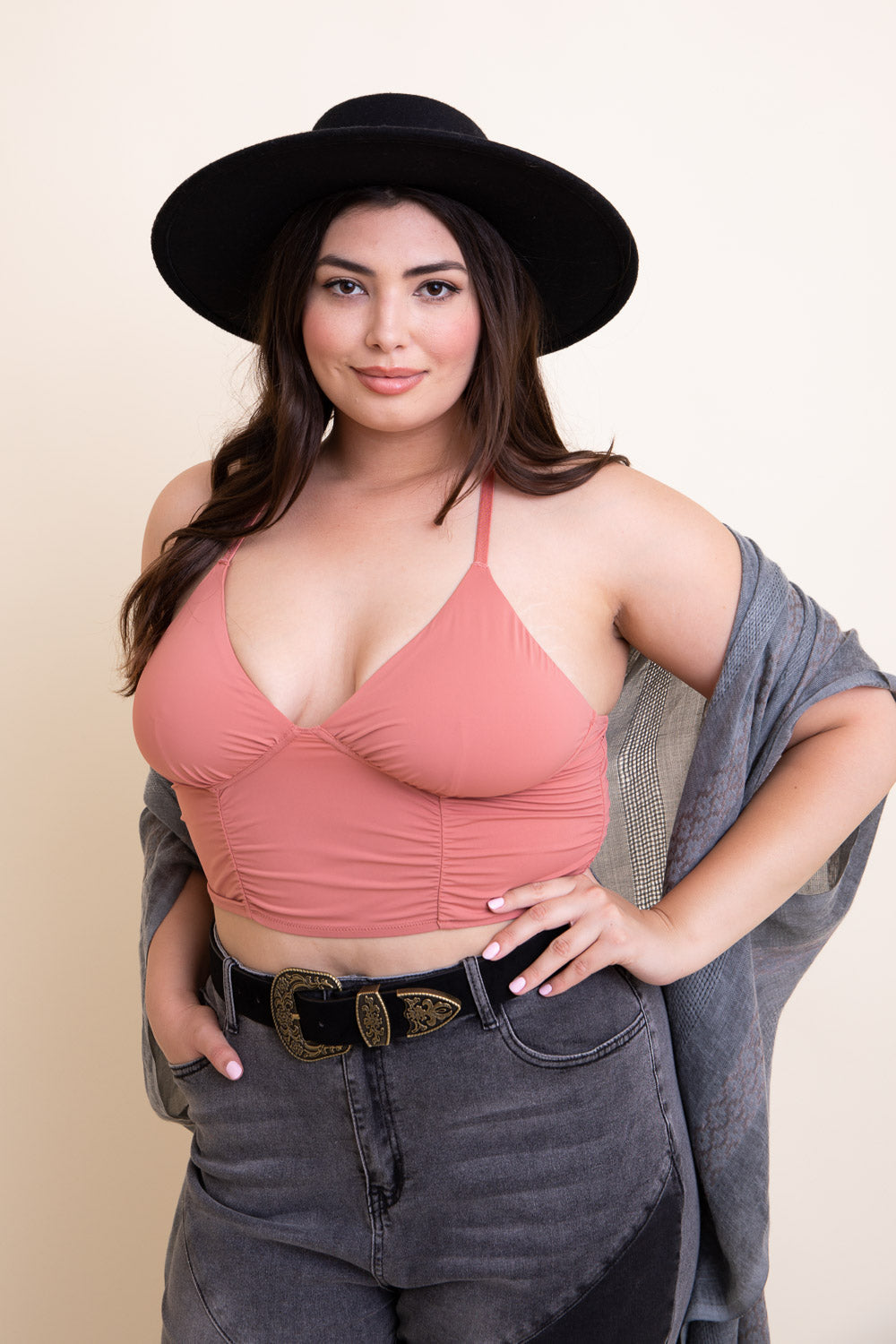 Pink ruched bralette tank top from Periwinkle Aether with adjustable straps and soft fabric.