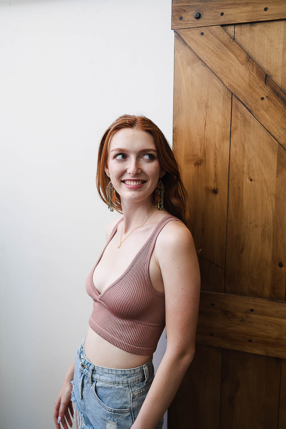 Reversible plunge seamless longline brami by Periwinkle Aether, soft pink and rose clay colors, smooth lingerie with adjustable straps.