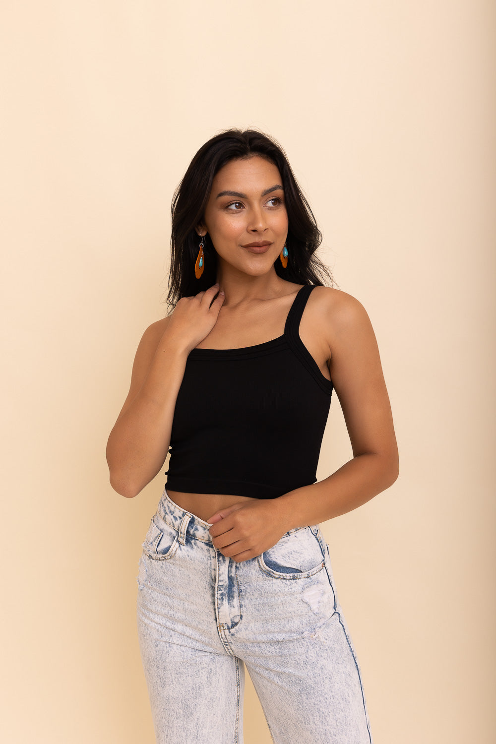 Black seamless brami top from Periwinkle Aether with a sleek, minimalist design, displayed on a plain background.