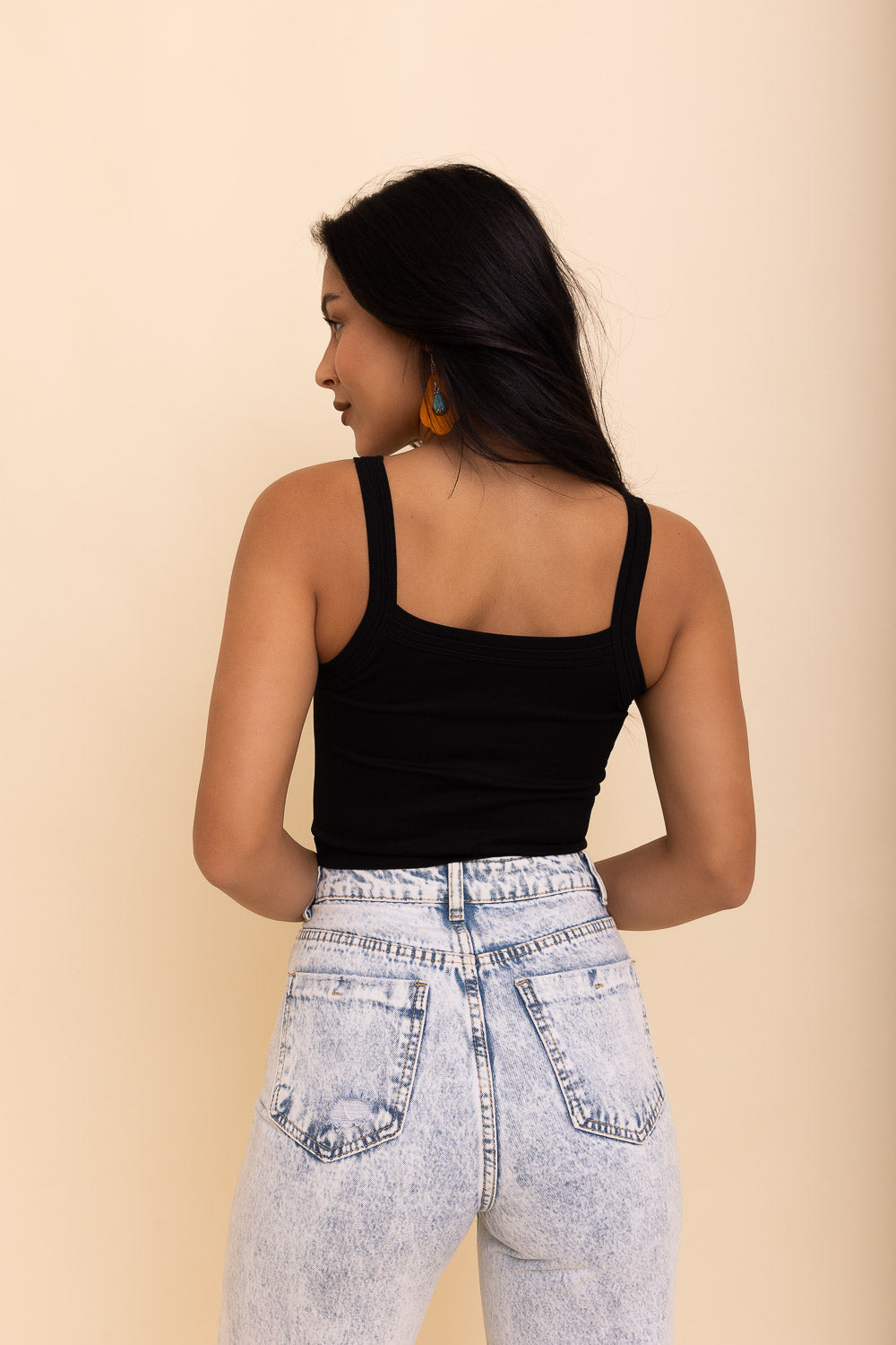 Black seamless brami top from Periwinkle Aether with a sleek, fitted design, perfect for layering or casual wear.