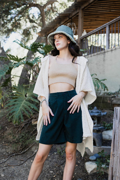 Ivory cozy soft waffle hooded ruana from Periwinkle Aether, lightweight accessories with a textured waffle pattern and hood.