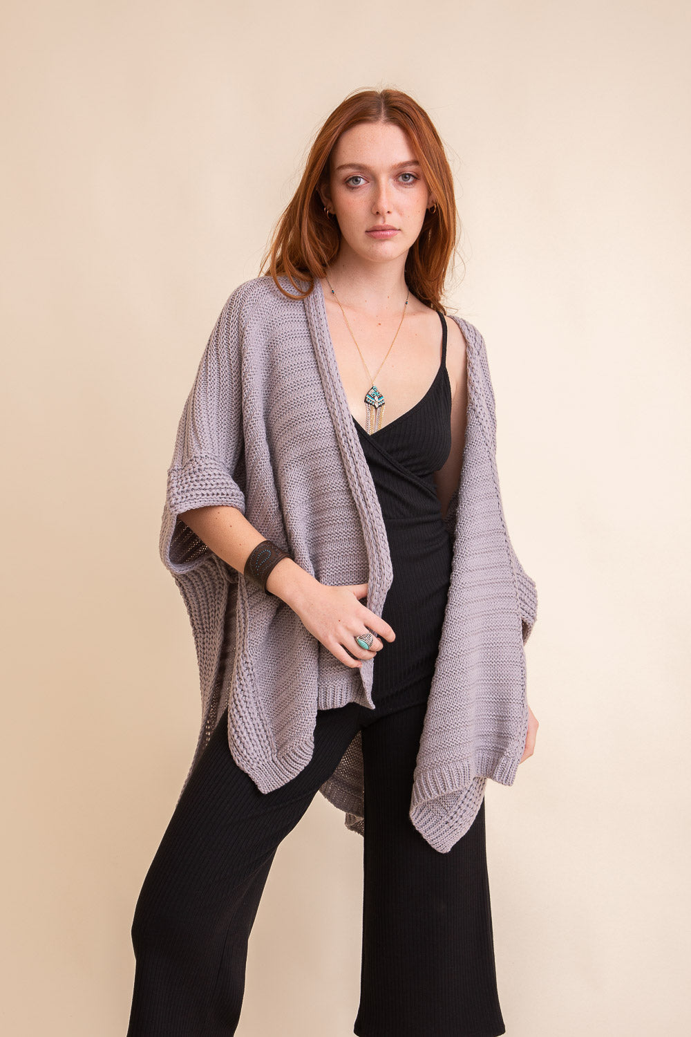 Gray ridged rib knit ruana by Periwinkle Aether, stylish layering wrap with textured knit design for cozy, chic accessories.